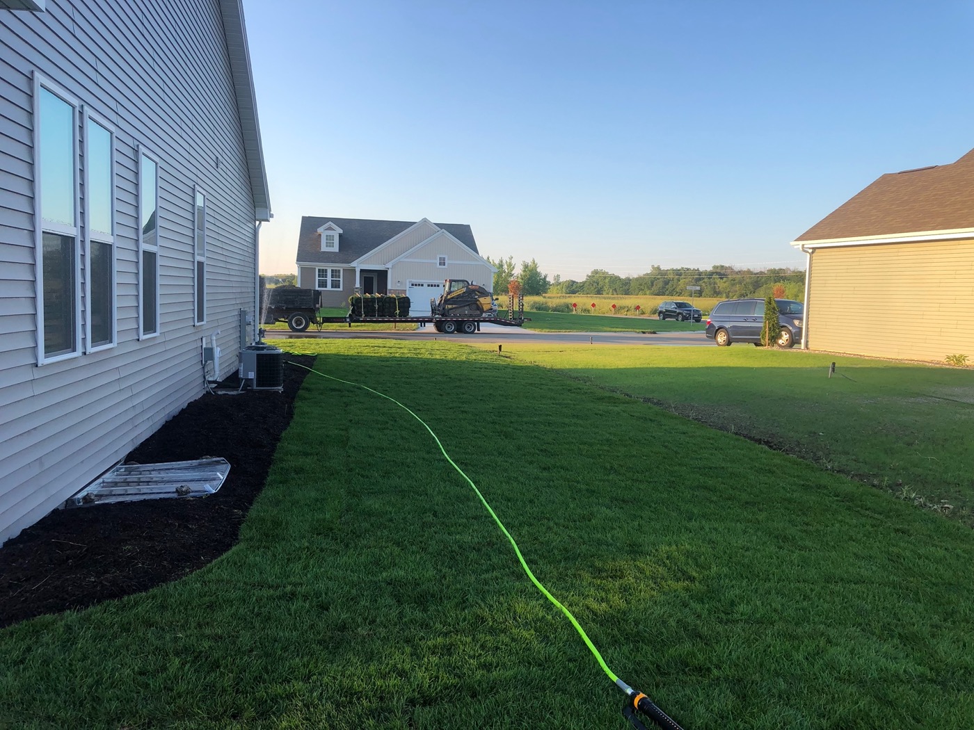 Fresh mulch installation in landscape beds, Jackson, WI